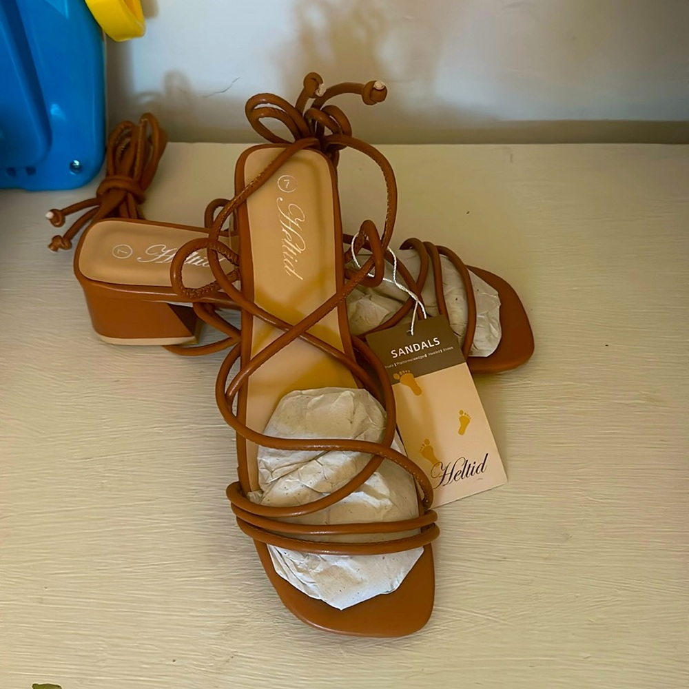 Beautiful sandals!!! NWT very comfy perfect for any occasion! Size 7 by Heltid.